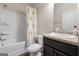 Bathroom featuring a shower-tub combo with sunflower curtain, toilet, and vanity with sink at 1011 Austin Rd, Ellenwood, GA 30294