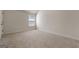 Neutral bedroom featuring plush carpeting, white walls, and a window that allows natural light at 1011 Austin Rd, Ellenwood, GA 30294