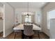Cozy dining area with a marble dining table and views through a large doorway at 1011 Austin Rd, Ellenwood, GA 30294