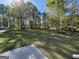 A spacious backyard with lush greenery and mature trees providing ample shade at 4430 Kings Hwy, Douglasville, GA 30135