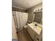 Cozy bathroom with white vanity, decorative mirror, and a toilet for everyday convenience at 4430 Kings Hwy, Douglasville, GA 30135