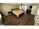 Main bedroom featuring hardwood floors, a ceiling fan, and natural light from a window at 4430 Kings Hwy, Douglasville, GA 30135