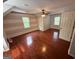 Large bedroom featuring hardwood floors, neutral walls, and natural light from multiple windows at 4430 Kings Hwy, Douglasville, GA 30135