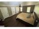 Primary bedroom with hardwood floors, ceiling fan, natural light and multiple doors with closet space at 4430 Kings Hwy, Douglasville, GA 30135