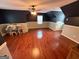 Spacious bedroom with hardwood floors, two-tone walls, and a ceiling fan for added comfort at 4430 Kings Hwy, Douglasville, GA 30135