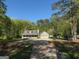 Charming home featuring a welcoming front porch and a convenient two-car garage at 4430 Kings Hwy, Douglasville, GA 30135