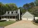 Charming home featuring a welcoming front porch and a convenient two-car garage at 4430 Kings Hwy, Douglasville, GA 30135