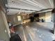 A spacious garage with ample storage cabinets and a functional utility sink at 4430 Kings Hwy, Douglasville, GA 30135