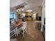 Spacious kitchen featuring tile floors, wooden cabinetry, a dining area and plenty of counter space at 4430 Kings Hwy, Douglasville, GA 30135