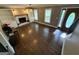 Bright living room features hardwood floors, fireplace, built-in shelves, and large windows for natural light at 4430 Kings Hwy, Douglasville, GA 30135
