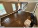 Well-lit living room featuring hardwood floors, large windows, and a chandelier at 4430 Kings Hwy, Douglasville, GA 30135