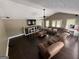 Inviting living room featuring hardwood floors, large windows, a ceiling fan, and a comfortable sofa at 4430 Kings Hwy, Douglasville, GA 30135