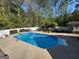 Enjoy this backyard pool with concrete surround and white fence at 4430 Kings Hwy, Douglasville, GA 30135