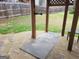 Outdoor patio area with stone flooring and wooden structure providing shade for gatherings at 1007 Oglethorpe Ct, Woodstock, GA 30188