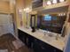 Bathroom features a double vanity, quartz countertops, dark cabinets, custom mirrors and large walk-in shower at 1007 Oglethorpe Ct, Woodstock, GA 30188
