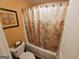 Charming bathroom with patterned shower curtain and coordinating wall art provides a relaxing space at 1007 Oglethorpe Ct, Woodstock, GA 30188