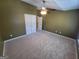 Open bedroom featuring a vaulted ceiling, ceiling fan, and ample closet space at 1007 Oglethorpe Ct, Woodstock, GA 30188