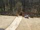 Fenced garden with stone walkway and raised planters at 1007 Oglethorpe Ct, Woodstock, GA 30188