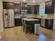 Modern kitchen features stainless steel appliances, granite countertops, and a center island with seating at 1007 Oglethorpe Ct, Woodstock, GA 30188