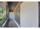 Inviting covered porch with a railing and ample space, providing a comfortable outdoor seating area at 482 E Lake Rd, Mcdonough, GA 30252