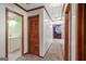 Hallway with neutral carpet, closet, and views of the bathroom and other rooms at 482 E Lake Rd, Mcdonough, GA 30252