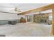 Spacious living room with a ceiling fan, stone fireplace, and open layout, perfect for entertaining guests at 482 E Lake Rd, Mcdonough, GA 30252