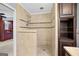 An elegant walk-in shower with beige tile, mosaic accents, and a rainfall showerhead at 482 E Lake Rd, Mcdonough, GA 30252