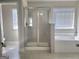 Bathroom featuring a tiled shower and soaking tub at 502 Hinton Farm Way, Dacula, GA 30019