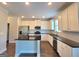 Modern kitchen featuring stainless steel appliances, granite countertops, and ample cabinet space at 502 Hinton Farm Way, Dacula, GA 30019