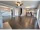 Bright and airy open floor plan combining living, dining, and kitchen areas with hardwood floors at 502 Hinton Farm Way, Dacula, GA 30019