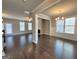 Spacious living room and dining area with hardwood floors and ample natural light at 502 Hinton Farm Way, Dacula, GA 30019