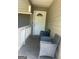 Covered front porch with chairs and a white door with a decorative window at 9503 Winding Way Ln, Jonesboro, GA 30238