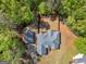 A nice lot with established trees surrounding a lovely gray home at 225 Suffolk Way, Mcdonough, GA 30252