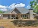 Spacious backyard with covered patio and grill, great for outdoor entertaining at 225 Suffolk Way, Mcdonough, GA 30252