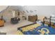 A sports themed bedroom featuring a sloped ceiling, and decorations at 225 Suffolk Way, Mcdonough, GA 30252