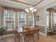 Bright dining area with large windows and view of the back yard at 225 Suffolk Way, Mcdonough, GA 30252