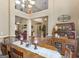 Open-concept dining room features hardwood floors and views of the living room at 225 Suffolk Way, Mcdonough, GA 30252
