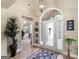 Inviting foyer with hardwood floors, decorative rug, and decorative wall art at 225 Suffolk Way, Mcdonough, GA 30252