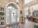 Bright foyer showcasing hardwood floors, chandelier, and open dining area at 225 Suffolk Way, Mcdonough, GA 30252