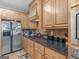 Kitchen features granite countertops, stainless steel appliances, and tiled backsplash at 225 Suffolk Way, Mcdonough, GA 30252