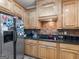 Kitchen featuring stainless steel refrigerator and granite countertops at 225 Suffolk Way, Mcdonough, GA 30252