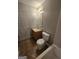 Standard bathroom featuring a single sink vanity, toilet, and a combined tub and shower at 403 Buckboard Ln, Locust Grove, GA 30248