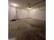 A large two car garage with ample room for parking and storage at 403 Buckboard Ln, Locust Grove, GA 30248