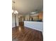 Open concept dining area and kitchen featuring modern appliances, hardwood floors, and ample counter space at 403 Buckboard Ln, Locust Grove, GA 30248