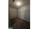 Spacious carpeted walk-in closet with built-in shelving for optimal storage solutions at 403 Buckboard Ln, Locust Grove, GA 30248