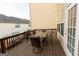 Spacious wooden deck offers a perfect setting for outdoor dining, featuring an outdoor table and chair set and neighborhood views at 6089 Indian Wood Se Cir, Mableton, GA 30126