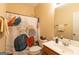 Well-lit bathroom features a decorative shower curtain, white fixtures, and clean, modern design elements at 6089 Indian Wood Se Cir, Mableton, GA 30126