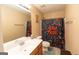Full bathroom featuring a single sink vanity and a shower with colorful curtain at 6089 Indian Wood Se Cir, Mableton, GA 30126