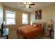 Cozy bedroom with natural light from two windows, carpeted floors, and warm beige walls at 6089 Indian Wood Se Cir, Mableton, GA 30126