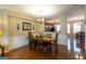 Elegant dining area with hardwood floors, modern light fixture, and access to other living spaces, offering a stylish setting at 6089 Indian Wood Se Cir, Mableton, GA 30126